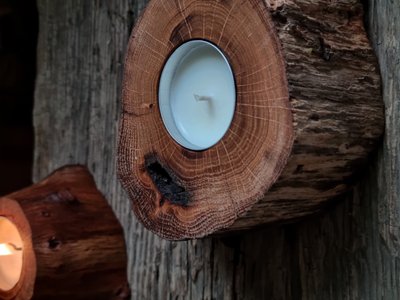 Wooden candlestick with a candle